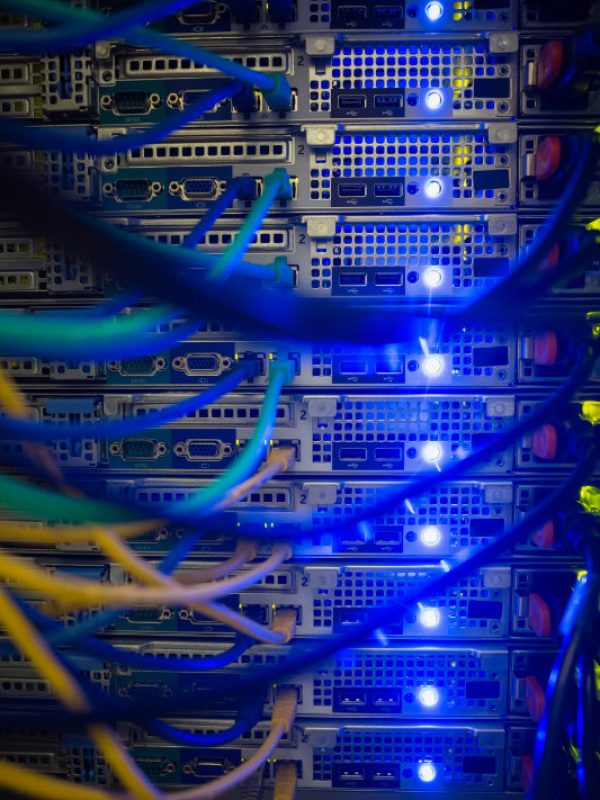 Interior of server with wires blue close up in data center